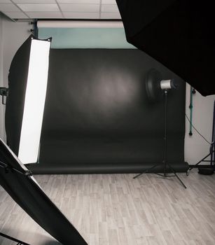 photo Studio with a variety of lighting equipment. photo with copy space