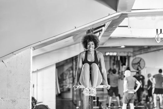 black woman doing parallel bars Exercise