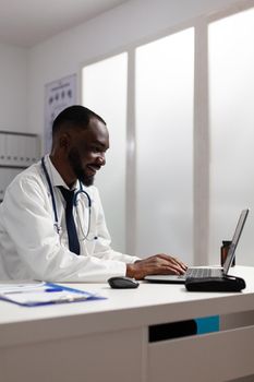African american specialist doctor analyzing medicine prescription document