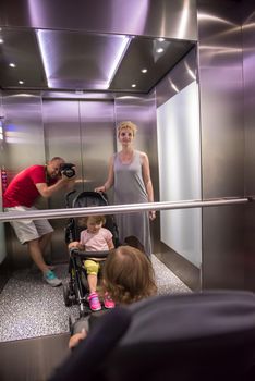 happy family in the elevator