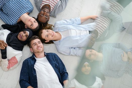  top view of a diverse group of people lying on the floor and symbolizing togetherness
