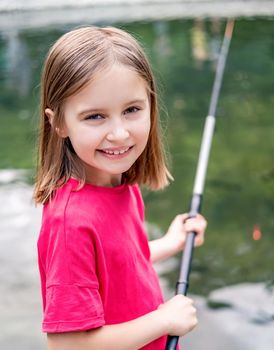 Little girl holding fishing rod