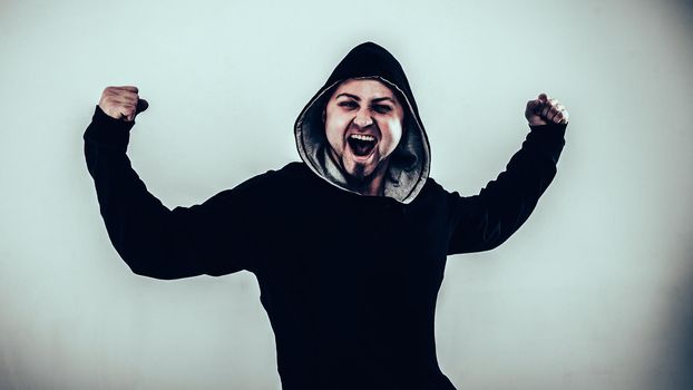 portrait of a energetic guy rapper on a light background