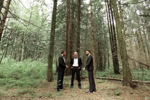 three business partners in the woods.Eco friendly and sustainable business