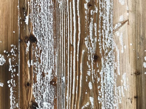 old wood covered with snow background