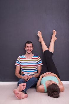 pregnant couple relaxing on the floor