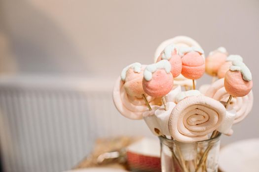 Festive sweets vanilla marshmallows and lollipops on sticks, party catering, ad photo for confectionery