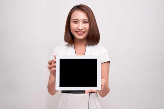 Asian business woman holding ipad tablet
