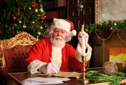 Portrait of Santa Claus answering Christmas letters.