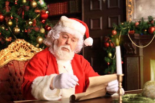 Portrait of Santa Claus answering Christmas letters.