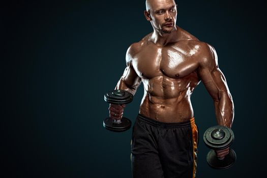 Bodybuilder posing. Beautiful sporty guy male power. Fitness muscled man