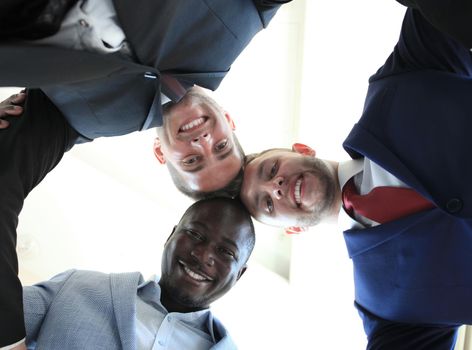 Low angle view of business people with their heads together