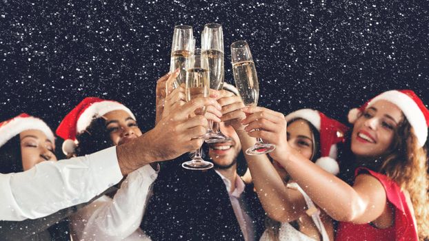 Diverse friends clinking with champagne glasses on New Year's Eve