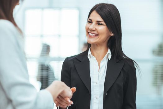 woman consultant meeting a client with a handshake