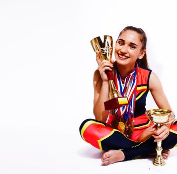 young smiling cheerleader girl with golden cups and price medals isolated on white background, lifestyle sport people concept