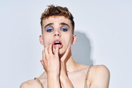 man with bright female makeup posing transgender freedom discrimination
