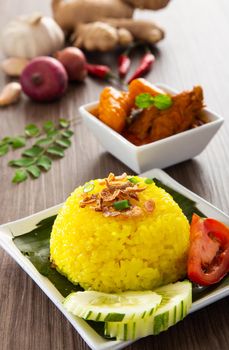 Nasi Kunyit also known as Turmeric Glutinous Rice. Normally eaten with dry curry chicken.