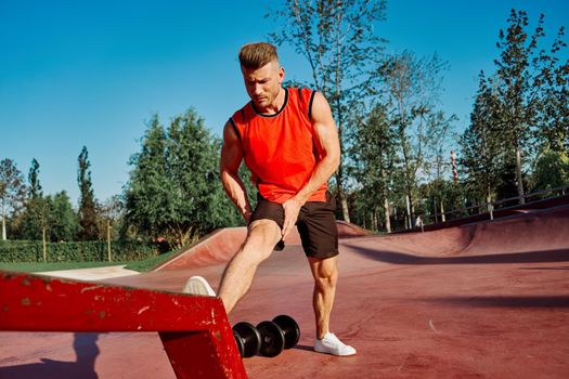 athletic man in red jersey workout exercise pumped up body