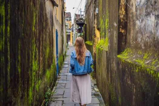 Woman tourist on background of Hoi An ancient town, Vietnam. Vietnam opens to tourists again after quarantine Coronovirus COVID 19
