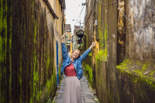 Woman tourist on background of Hoi An ancient town, Vietnam. Vietnam opens to tourists again after quarantine Coronovirus COVID 19
