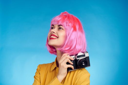 pretty woman with pink hair photographer with camera creative profession
