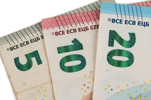 Close-up of five, ten and twenty euro bills.