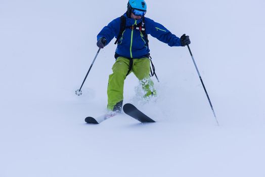 freeride skier skiing downhill