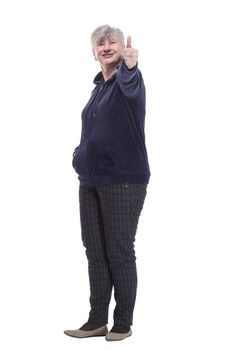 casual elderly woman in comfortable clothing showing a thumbs up
