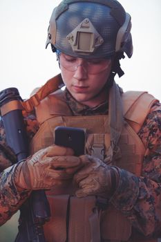 soldier using smart phone