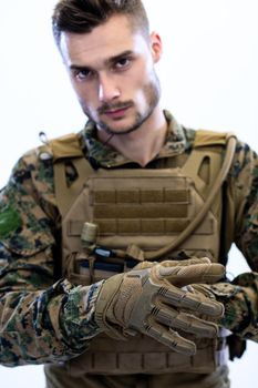 closeup of soldier hands putting protective battle gloves