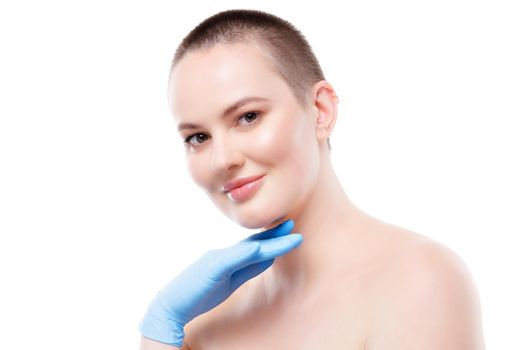 Portrait of a nude short-haired woman in sterile gloves