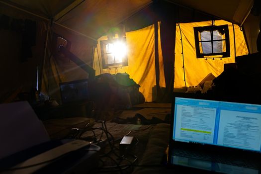 Inside the tent of the geological expedition. The work of the expedition in the forest, life inside the tent