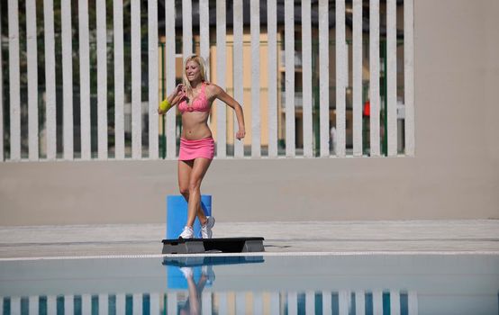 fitness exercise at poolside