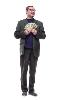 full-length. casual man showing a bundle of banknotes.