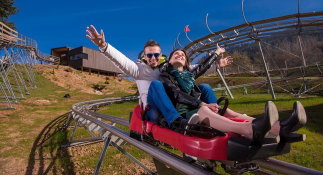 couple driving on alpine coaster
