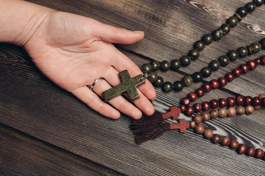beads with orthodox cross wooden background catholicism christianity