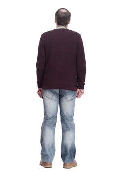 rear view. casual man in jeans and a jumper .