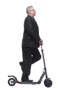 Side view of a man wearing suit with scooter