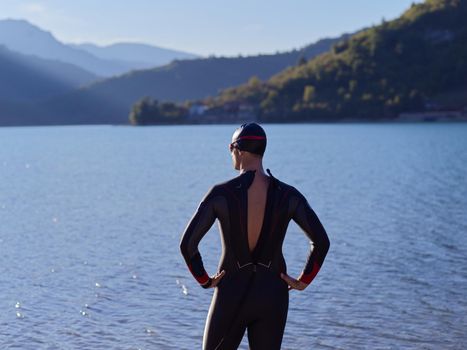triathlete swimmer portrait wearing wetsuit on training