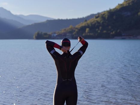 triathlete swimmer portrait wearing wetsuit on training