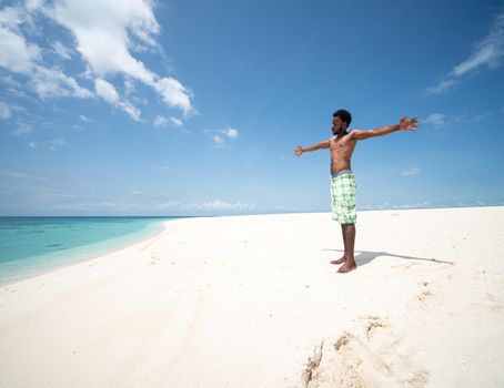 Young black African man on beautiful beach sea coast