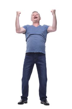 Exciting smiling man in casual clothes with arms raised