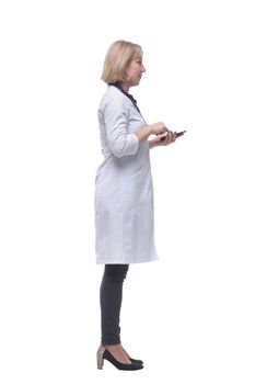 Profile of concentrated female doctor reading text message