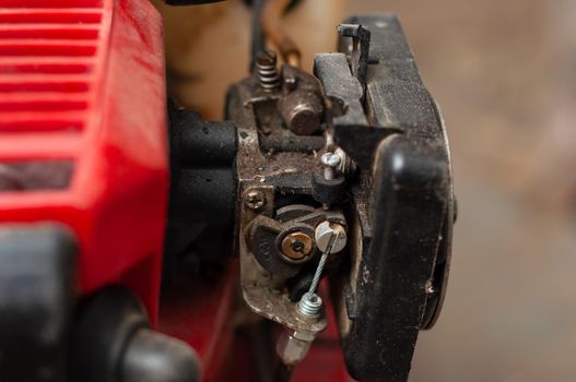 Carburetor of a two-stroke engine of a walk-behind tractor