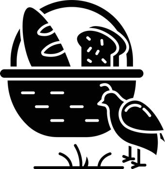 Manna and quail Bible story glyph icon. Bread loaves in basket and fowl. Religious legend. Christian religion. Biblical narrative. Silhouette symbol. Negative space. Vector isolated illustration