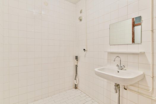Miniature bathroom with white tiles