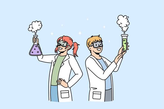 Happy children do science experiments in school lab