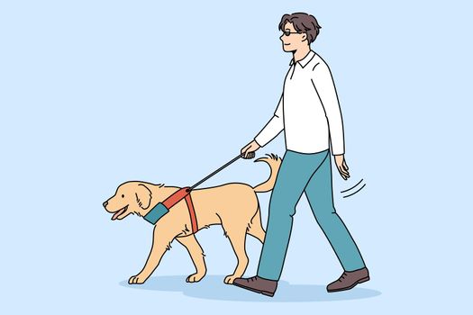 Trained guide dog help blind man