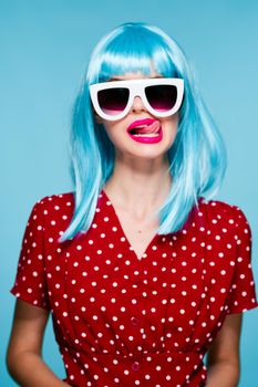 pretty woman fashion blue wig posing sunglasses. High quality photo