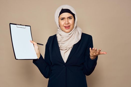 muslim woman with documents in hands office work business